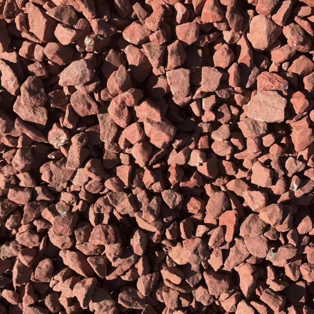 Close-up of red decorative gravel stones.